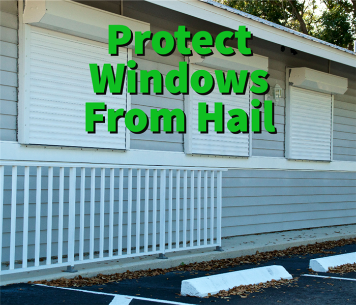 storm shutters protecting windows from hail damage